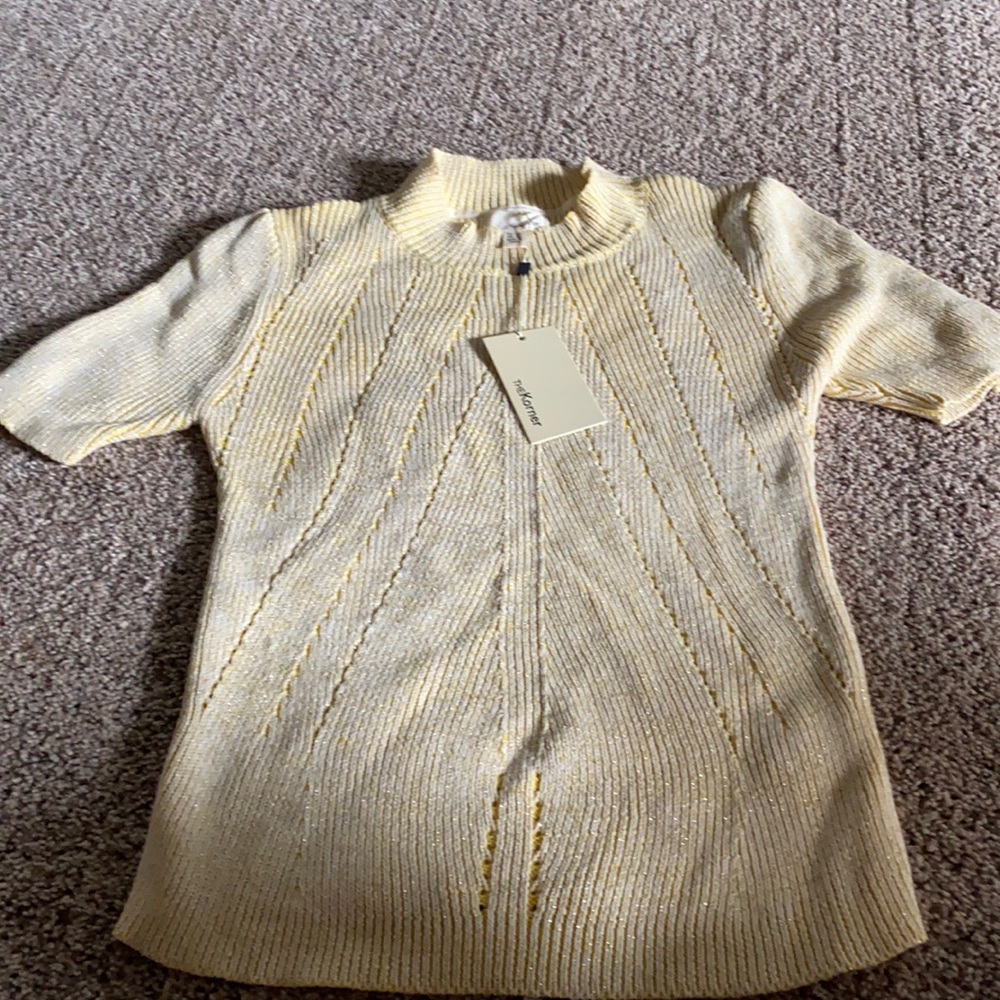 Super cute short sleeve sweater. Size medium/large . Yellow with gold flakes .